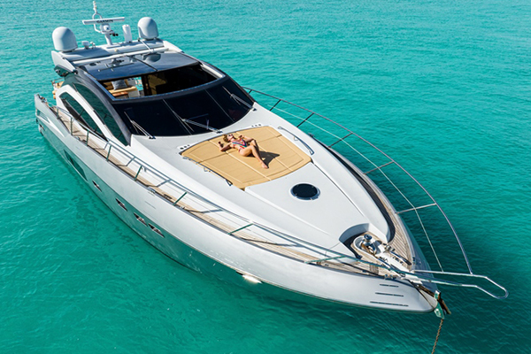 Luxury motor yacht cruising the turquoise waters of the Bahamas.