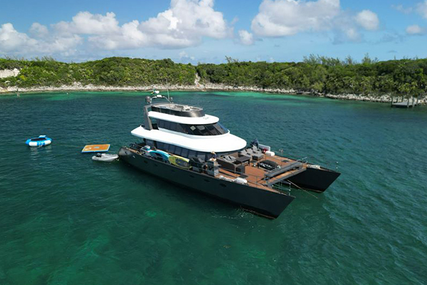 Mega yacht deck prepared for an elegant dinner party at sunset. Bahamas